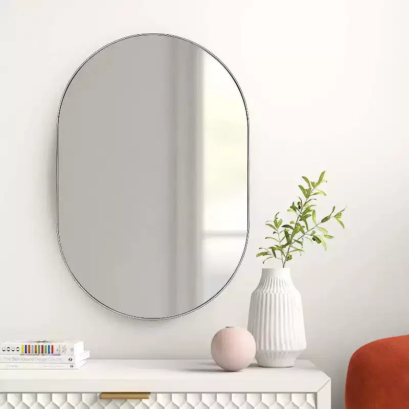 Miroir ovale en métal doré