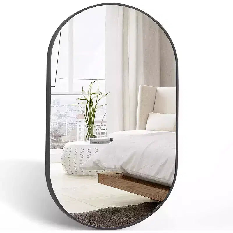 Miroir ovale en métal doré