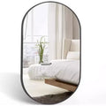 Miroir ovale en métal doré