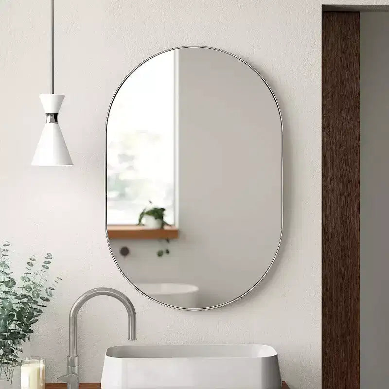 Miroir ovale en métal doré